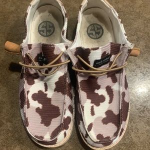 Simply Southern Brown cow-print shoes.